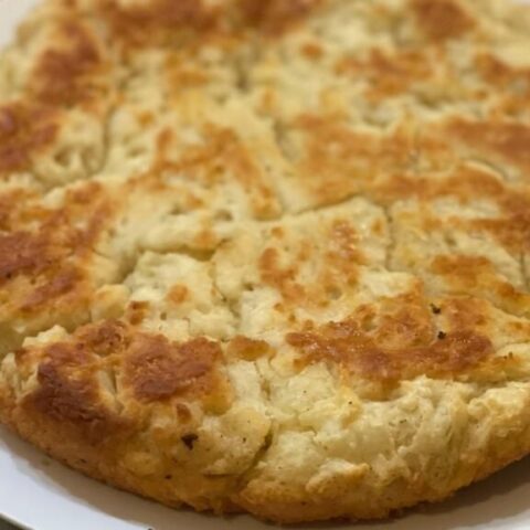 fresh baked skillet bread dumped out of a plate