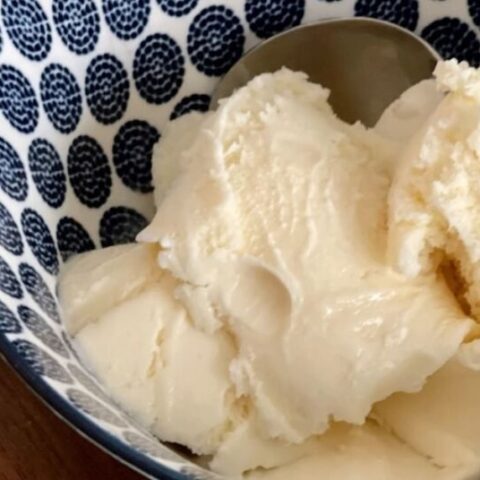 homemade country vanilla ice cream in a blue and white bowl